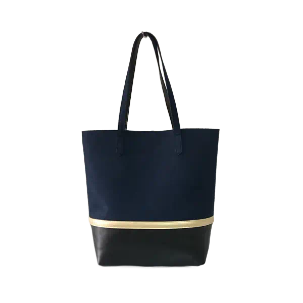 Damen-Tote mit Goldstreifen kontrastiert mit einer stilvollen City-Handtasche